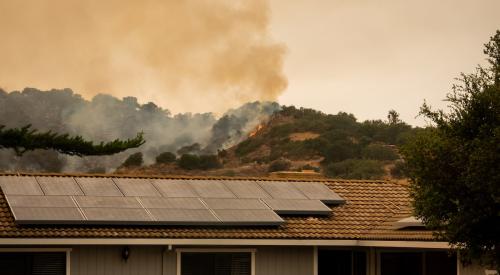 California wildfire behind home