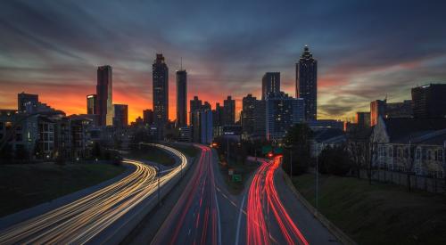 Traffic entering and leaving city at dusk