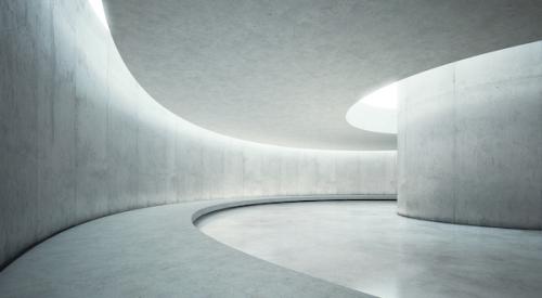 Concrete hallway with curved wall