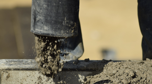 Concrete pump pouring concrete for home foundation