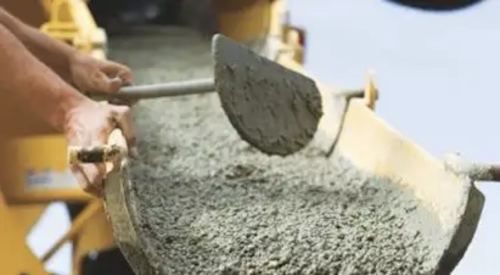 Concrete being pumped onto construction site for a home's concrete foundation