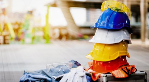 Construction protective equipment stacked on job site