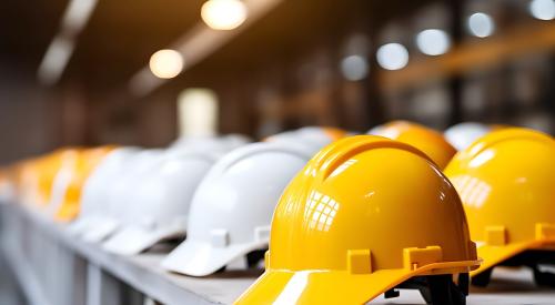 Yellow and white hard hats lined up