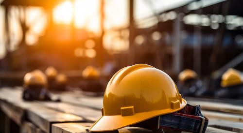 Orange hard hats on construction jobsite