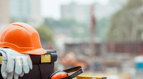 Construction equipment with jobsite in background