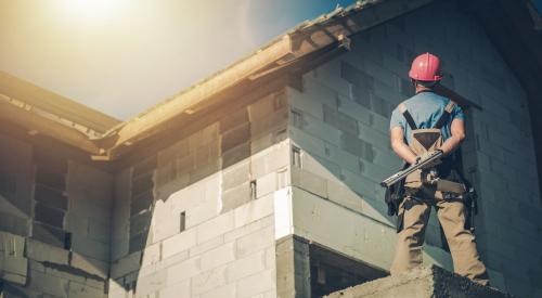 Construction supervisor overlooking project