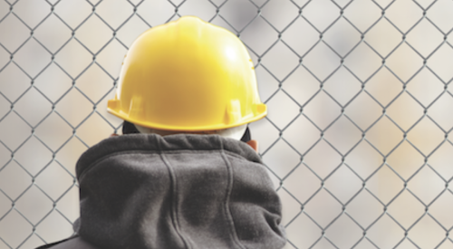 Construction worker wearing yellow hardhat