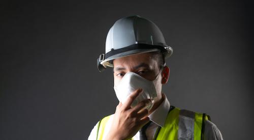 construction worker wearing protective face mask