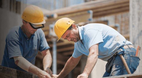 Two construction workers on jobsite