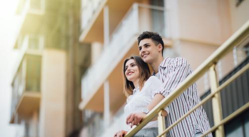 Couple on balcony looking out