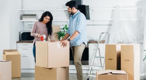 Couple packing boxes