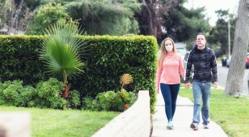 Couple walking in suburbs