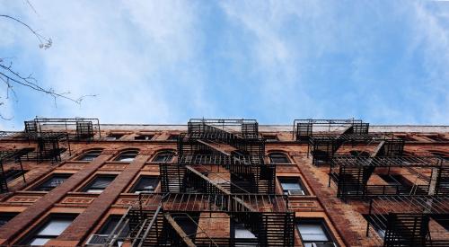 Building exterior | Multifamily real estate had one of its best since 2000: multifamily debt hit an all-time high, renters paid more for housing than ever, and deliquencies remained at historic lows.