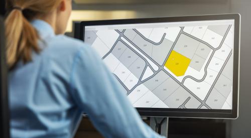 Woman looking at zoning map on computer 