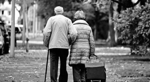 Elderly couple walking together