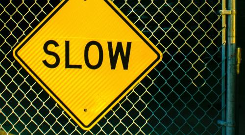 Slow sign on chainlink fence