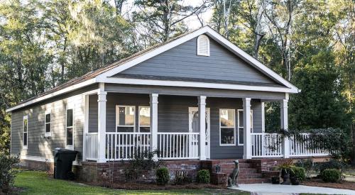 Entry level house surrounded by trees