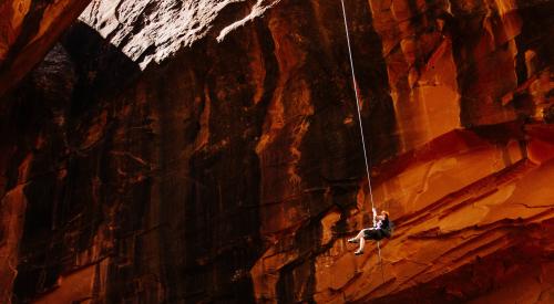 Person rappeling in a cave