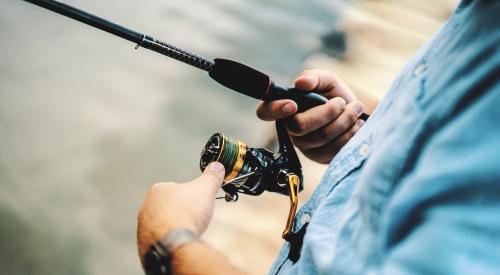 Person with fishing reel