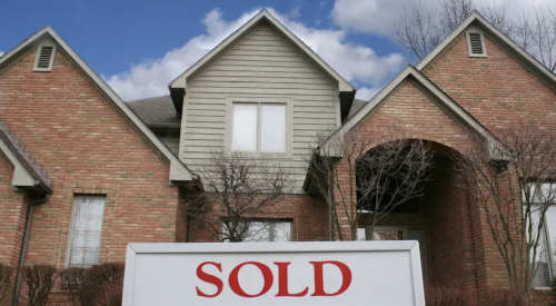 Sold sign in front of existing home 