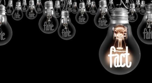 The word 'fact' illuminated inside a light bulb