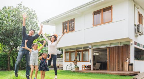 Family in front of home