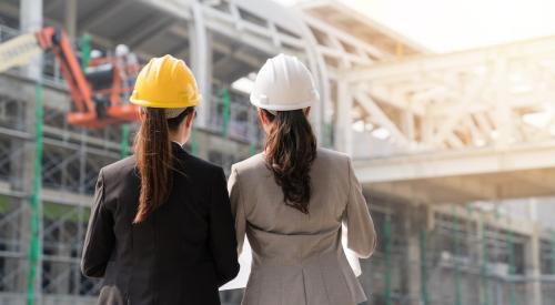 Female architects looking at project