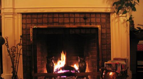 Christmas_tree_and_stocking_hung_over_fireplace