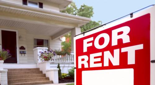 Red and white for rent sign outside house