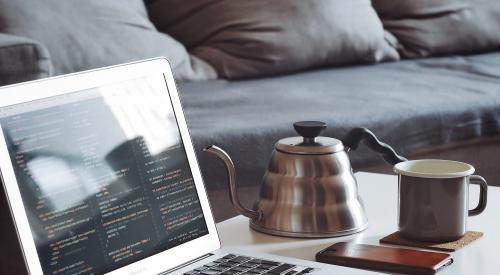 Laptop with coffee percolator and mug