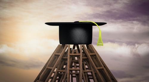 Graduation cap on a stack of ladders