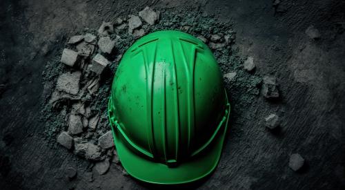 Green hard hat on ground