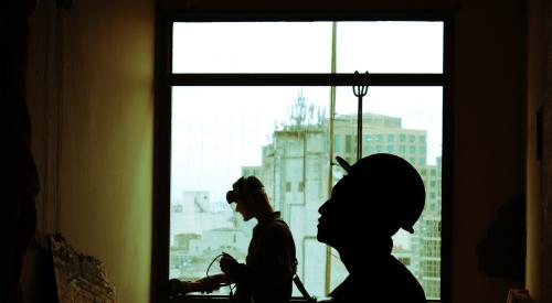 Construction workers in prefab structure