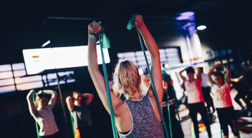 Woman leading fitness class for wellness