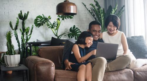 Happy family sitting on couch