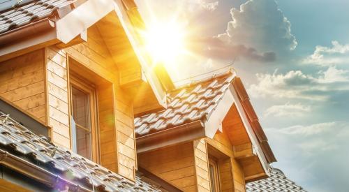 Sun reflecting off tiled roof of single-family home