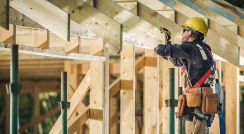 Home builder looking at frame