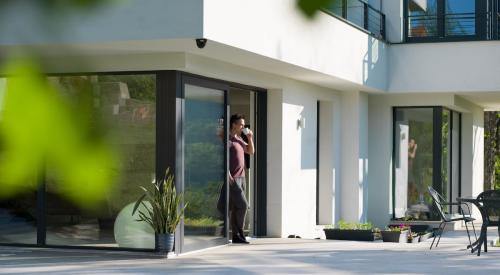 Homeowner standing outside on patio