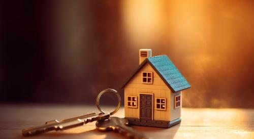 Small house with a blue roof and house keys