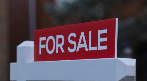 Red and white house for sale sign