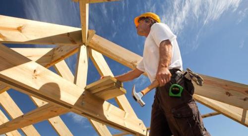 Construction worker framing a house