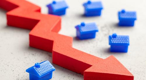 Blue houses next to falling red arrow