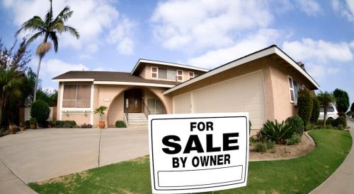 White and black for sale sign outside of Florida home