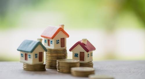 Houses stacked on top of coins