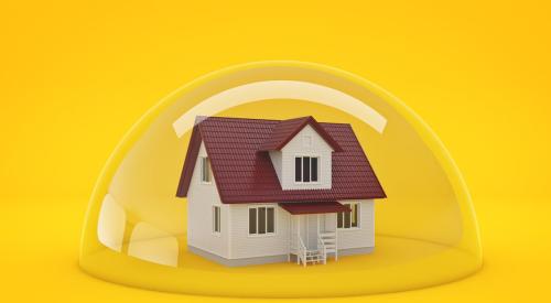 House trapped in bubble with yellow background