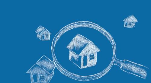 Blueprint of houses under magnifying glass with blue background