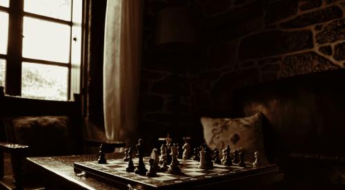 Chess game on table in home