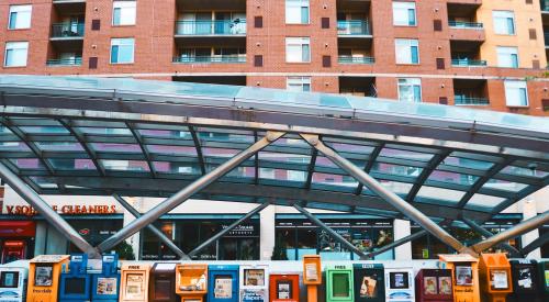 Newspaper vending units at a transit station