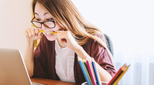 Frustrated woman on laptop