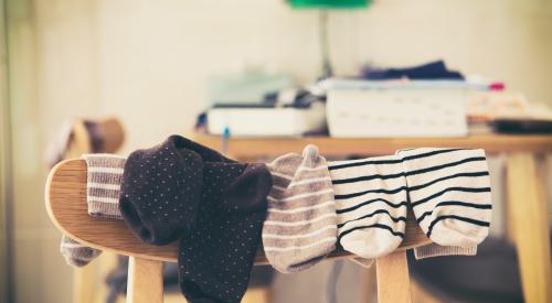 Socks hanging on back of chair in home